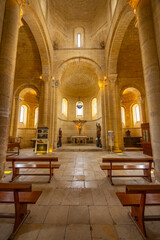 Obraz premium Interior of San Martin Church showing altar, benches and romanesque architecture in Fromista, Spain
