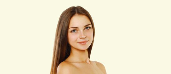 Fototapeta premium Beauty portrait of brunette young woman on white studio background