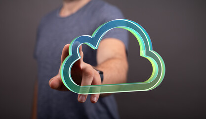 Image of a person interacting with a digital cloud icon, representing cloud computing, data...