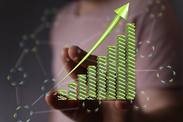Illustrates business growth and financial success with an upward trending bar graph. Ideal for...