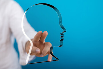 Abstract image of a person interacting with a transparent head outline, symbolizing ideas,...