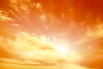 Orange sky with clouds during hot summer weather