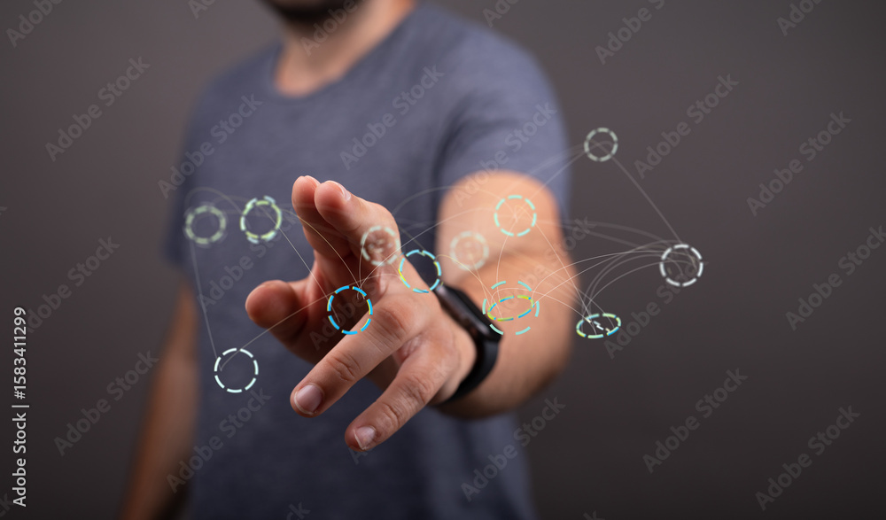 Poster close-up of a man's hand interacting with a digital network visualization. modern technology concept