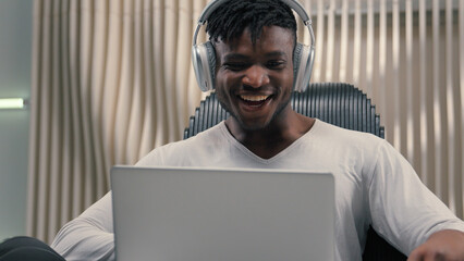 African American ethnic cyber man in white futurism studio indoors business male user gamer hacker...