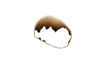 Realistic burnt paper hole with scorched, ragged edges. A grunge texture element for a vintage...
