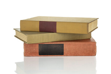 A stack of old vintage books, a pile of classic literature for education and study. These hardcover...