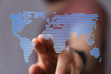 Hand interacting with a digital world map, representing global connectivity and networking.