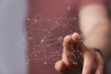Abstract image of a hand interacting with a digital network, representing connectivity and data...