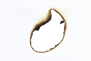 Abstract burnt hole in white paper with detailed scorched edges. A vintage grunge texture element perfect as a frame or for a damaged effect design, isolated on white background with clipping path.