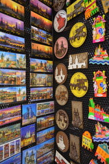 A collection of various colorful refrigerator magnets attached to a fridge door, often used as...