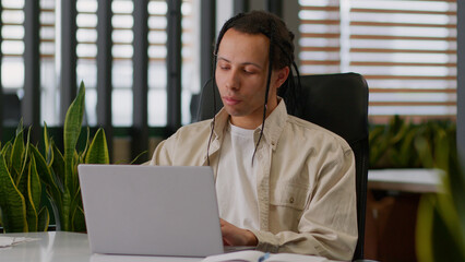 African American ethnic multiracial man business male professional creative guy businessman typing...