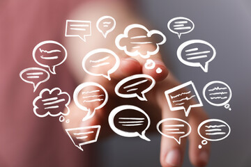 Abstract image of hand interacting with digital speech bubbles, representing communication and...