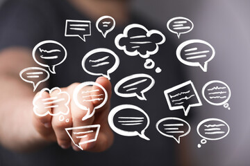 Abstract image of hand interacting with digital speech bubbles, representing communication and...