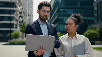 Multiracial business people walk in city multiethnic colleagues Caucasian businessman man male guy...