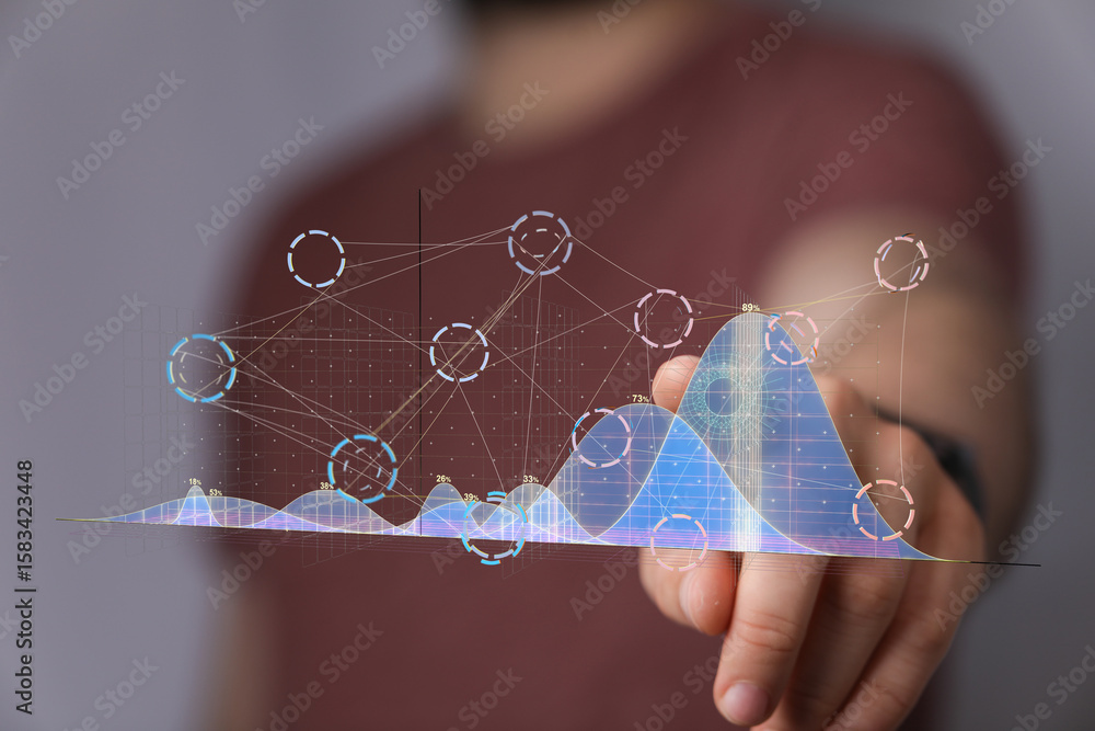 Poster person interacting with a holographic graph showing data analysis and business insights.