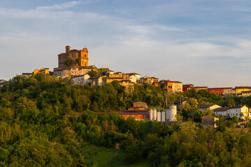 Treville, Italy, shines under the setting sun, revealing its charming architecture and lush...