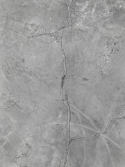 Background of cracked concrete surface. Rough surface texture of crack pattern on concrete. Cracked concrete wall surface due to age, ground movement, excessive load, or extreme temperature changes.