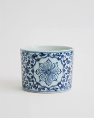 Decorative porcelain blue and white floral pot on plain white background