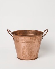 Vintage copper metal flower pot with handles on plain white background