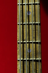 Guitar strings close-up. Guitar fretboard. Musical instrument. Hobby. Close-up of guitar neck with...