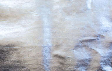 Shiny silver foil texture with crinkled and metallic surface. Ideal for luxury design, festive backgrounds, packaging, or elegant graphic elements