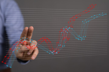 Stock photo of a hand interacting with a 3D graph showing business growth trends. Perfect for...