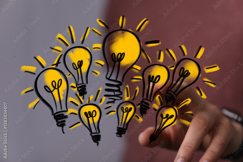 Poster conceptual image of multiple lightbulbs, symbolizing creativity, teamwork, and problem-solving.