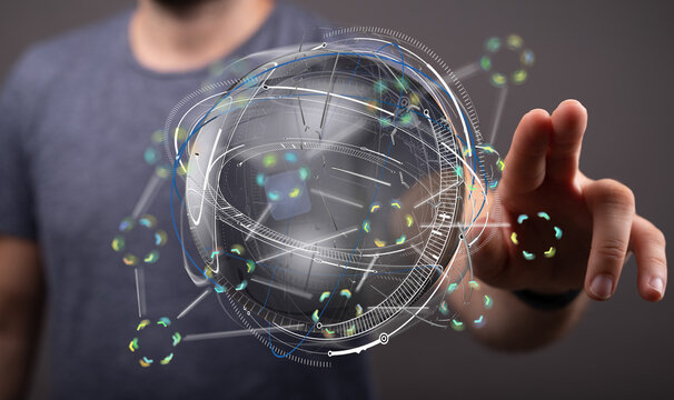 Stock photo of a person interacting with a digital globe, representing global network, technology, and connection.