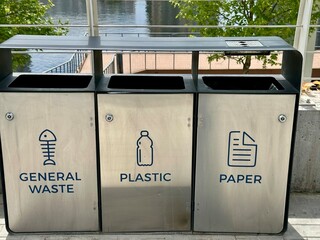 Metallic recycling bins in the park