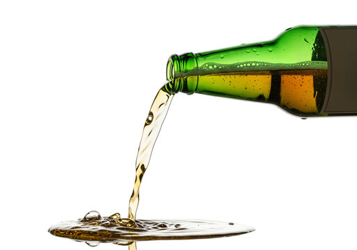A green glass bottle pours golden beer onto a reflective surface. The background is transparent, highlighting the liquid's movement and bubbles.