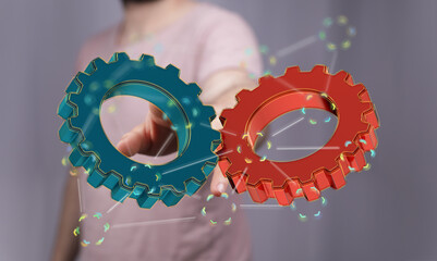 Image of two gears meshing, symbolizing teamwork, collaboration, and efficient processes.