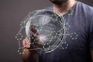 Futuristic image of a person interacting with a digital globe, representing global connection and...