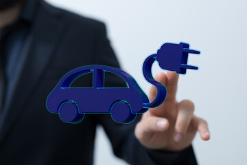 Image of a businessman interacting with a 3D model of an electric car charging.  Perfect for EV,...