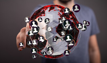 A person interacts with a digital globe showing interconnected people, representing global...