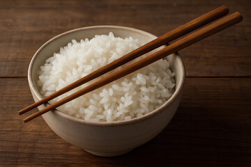 Chopsticks Placed Neatly on a Bowl Full of Steamed White Rice