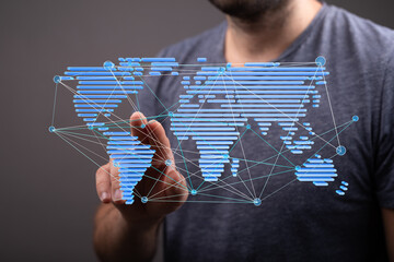 Man interacts with a digital world map, showcasing global connectivity and networking.