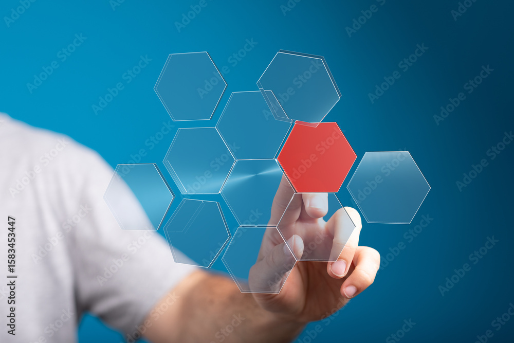 Aufkleber person interacts with a digital hexagon network, highlighting a key data point.