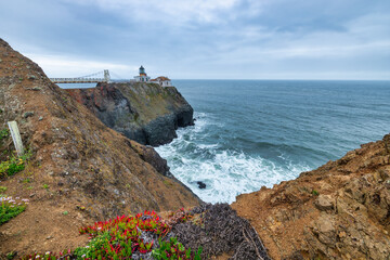 Point Bonita Lighthouse on rugged cliffs above the Pacific Ocean in Marin Headlands, California....