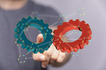 Image of two gears meshing, symbolizing teamwork, collaboration, and efficient processes.