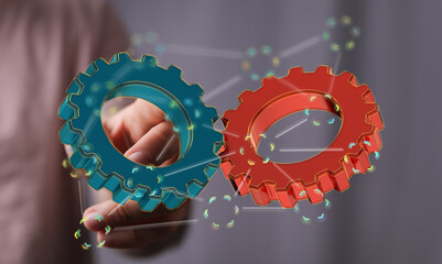 Image of two gears meshing, symbolizing teamwork, collaboration, and synergy.