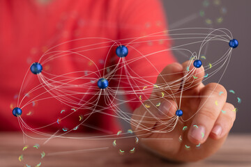 Hand interacting with a digital network.  Concept of global connectivity, communication, and data...