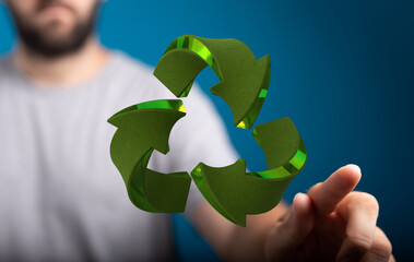 Person interacting with a 3D recycle symbol.  Eco-friendly, sustainability concept.