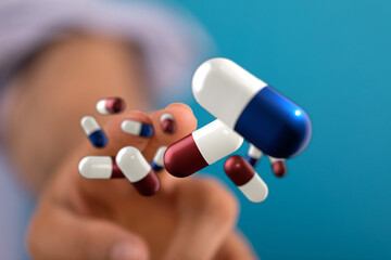 High-quality photo of hand holding various medicine capsules. Perfect for healthcare, pharmacy, and...