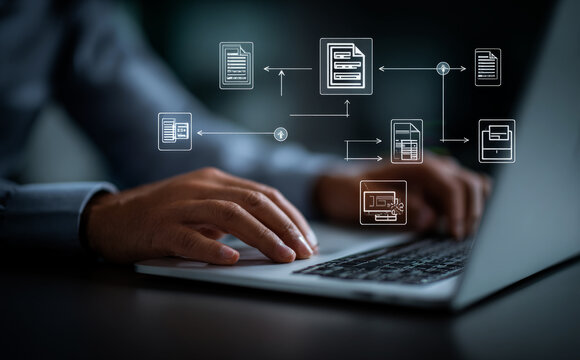  person using a laptop computer with a flow chart diagram and document icons on a virtual screen