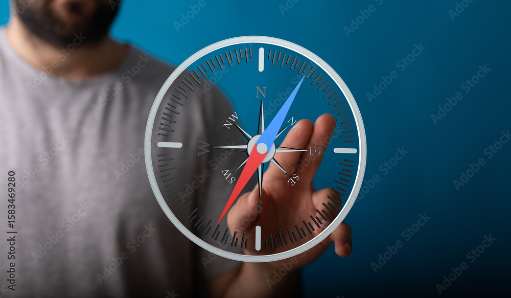 Poster stock photo of a man using a digital compass app on a touchscreen device. find your way.