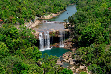Aerial view of Krang Suri Waterfall, Meghalaya, amidst lush green forest.