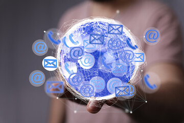 Image depicting worldwide communication. Shows interconnected emails, phones, and internet symbols.