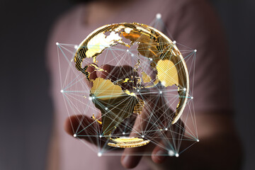 Person interacting with a digital globe, showcasing global connectivity and network.