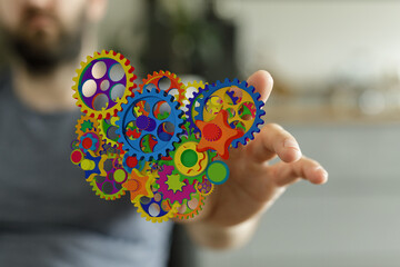 Image of colorful gears representing innovation, teamwork, and complex processes. Perfect for...