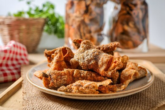 crispy salmon skin,fried salmon skin in ceramic plate 
